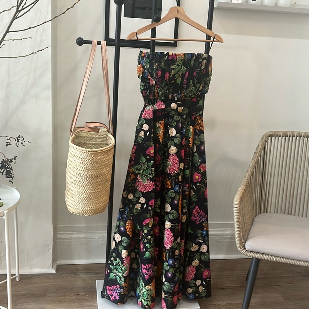 Couture floral floor-length dress with pleated bodice and sashed waist